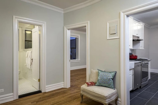 corridor featuring ornamental molding and dark hardwood / wood-style floors