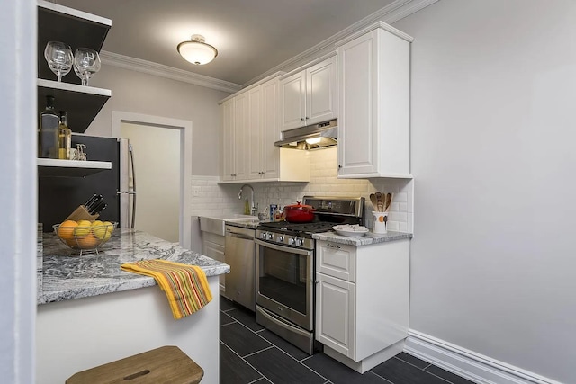 kitchen featuring white cabinetry, ornamental molding, stainless steel appliances, and tasteful backsplash