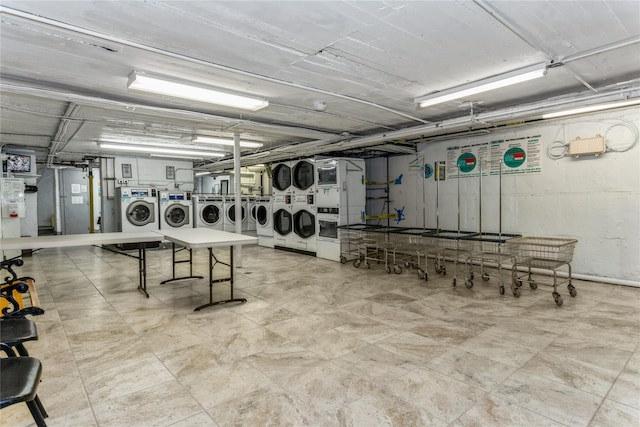 washroom with washing machine and clothes dryer