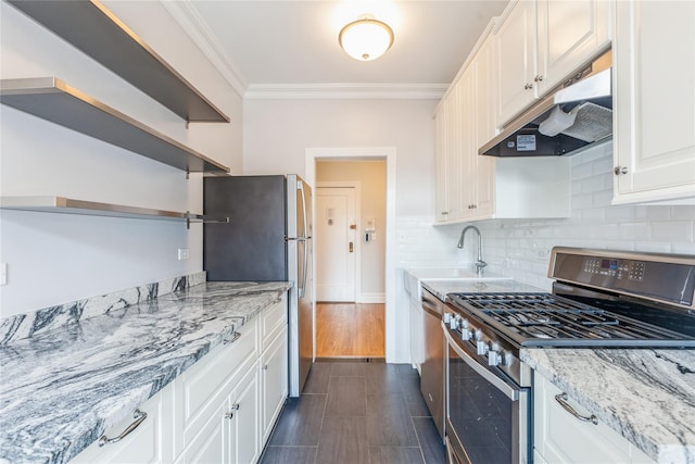 kitchen featuring white cabinetry, sink, light stone counters, and stainless steel appliances