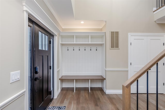 mudroom featuring wood-type flooring and ornamental molding