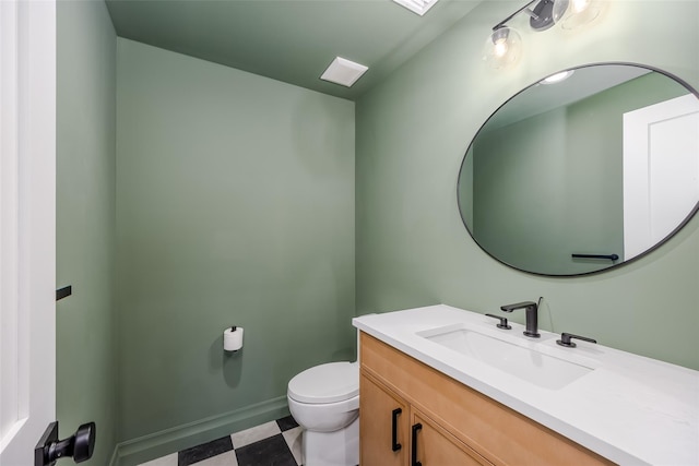 bathroom with toilet and vanity