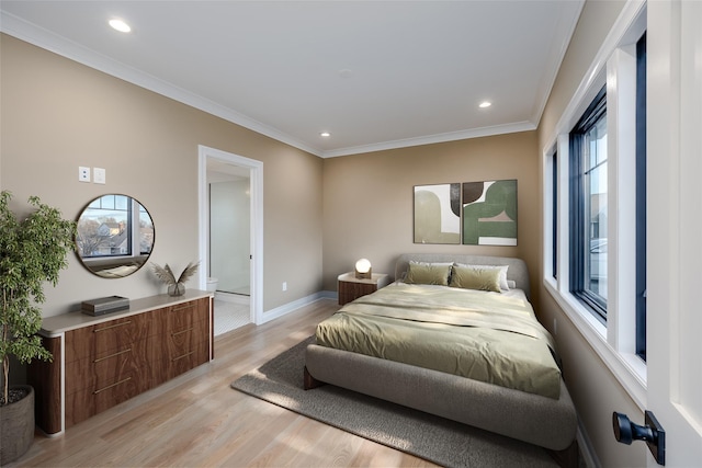 bedroom featuring light hardwood / wood-style floors, multiple windows, and ornamental molding