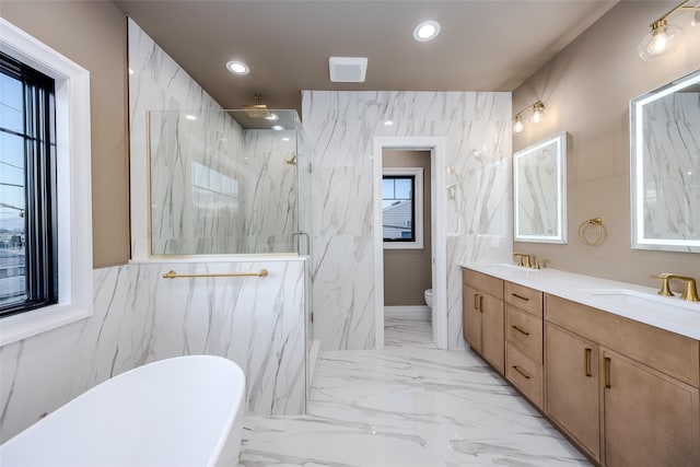 full bathroom with vanity, toilet, and separate shower and tub