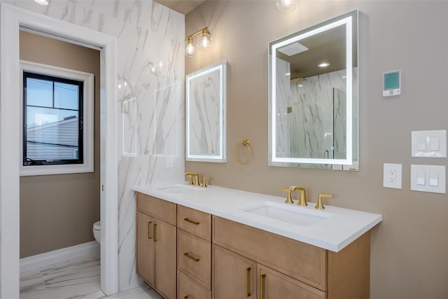 bathroom featuring vanity, toilet, and walk in shower