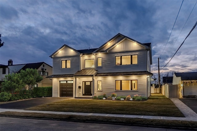 view of front facade featuring a garage and a front lawn