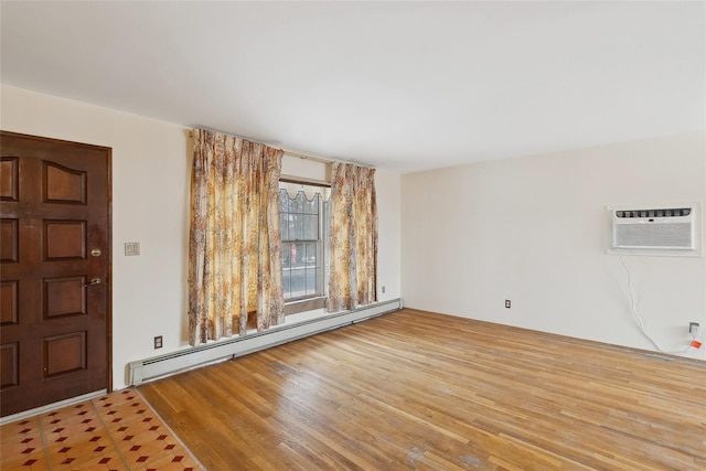 foyer featuring an AC wall unit, baseboard heating, and hardwood / wood-style flooring