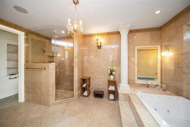 bathroom featuring plus walk in shower, tile walls, and ornate columns