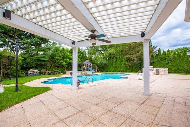 view of swimming pool featuring a patio area, a playground, ceiling fan, area for grilling, and a pergola