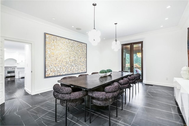 dining area featuring ornamental molding and french doors