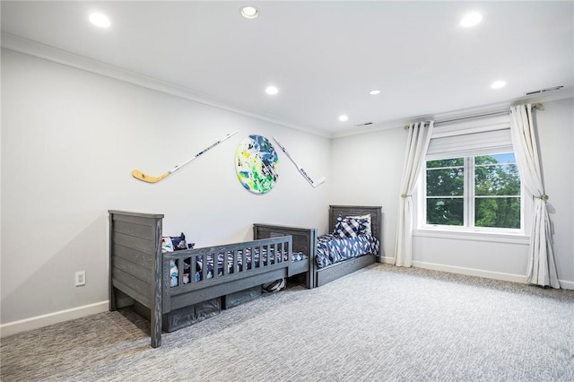 bedroom featuring ornamental molding and carpet flooring