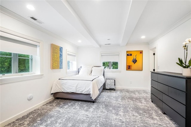 bedroom with beamed ceiling, crown molding, carpet floors, and multiple windows