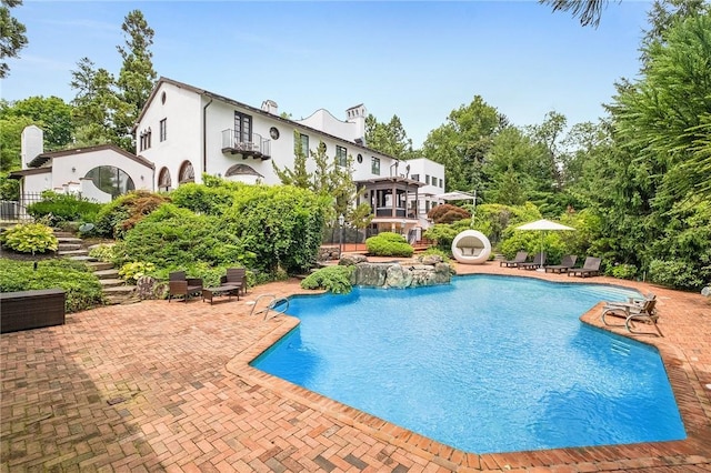 view of pool featuring a patio area