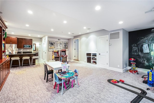 game room with light colored carpet