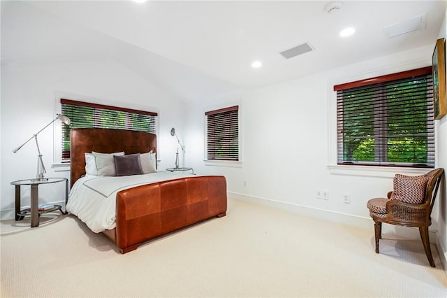 carpeted bedroom featuring lofted ceiling