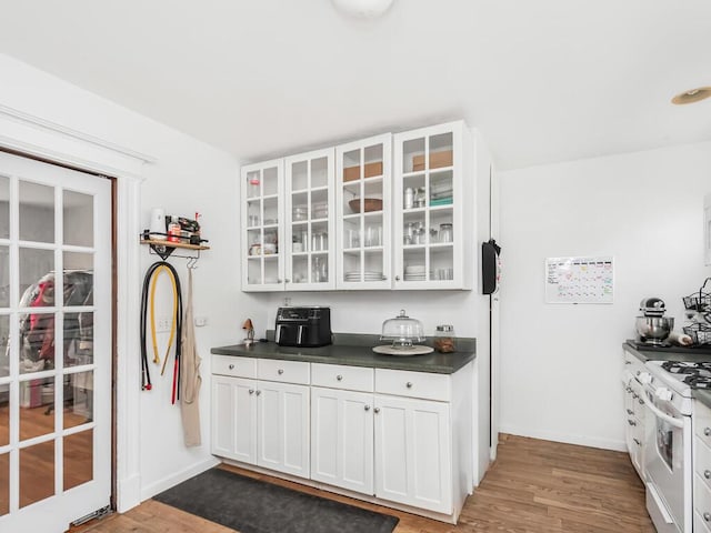 kitchen featuring white cabinetry and dark hardwood / wood-style floors