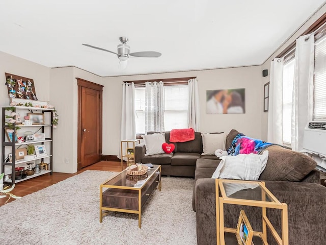 living room featuring ceiling fan, hardwood / wood-style flooring, and a wealth of natural light