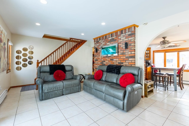 tiled living room featuring a baseboard radiator and ceiling fan