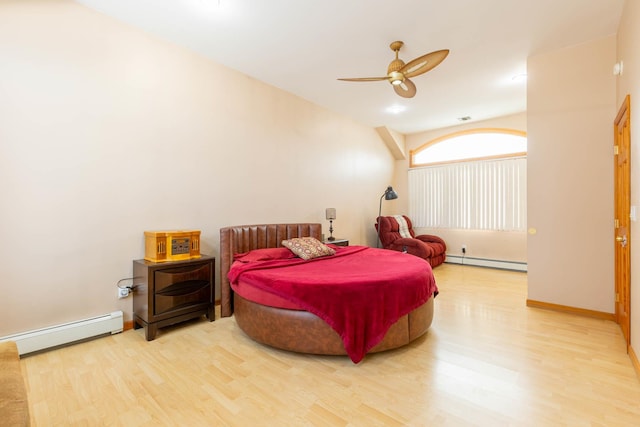 bedroom with ceiling fan, a baseboard radiator, and hardwood / wood-style flooring