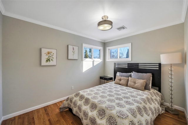 bedroom featuring ornamental molding and wood-type flooring