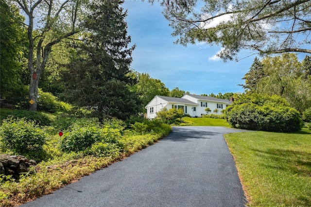 94 S Quaker Hill Rd, Pawling, NY 12564 - split level home featuring asphalt driveway and a front yard