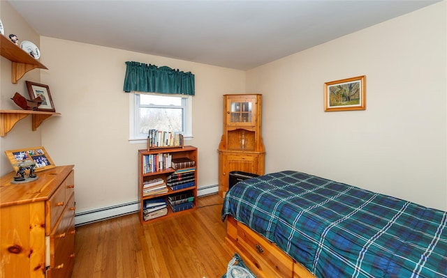 94 S Quaker Hill Rd, Pawling, NY 12564 - bedroom featuring a baseboard radiator and wood finished floors