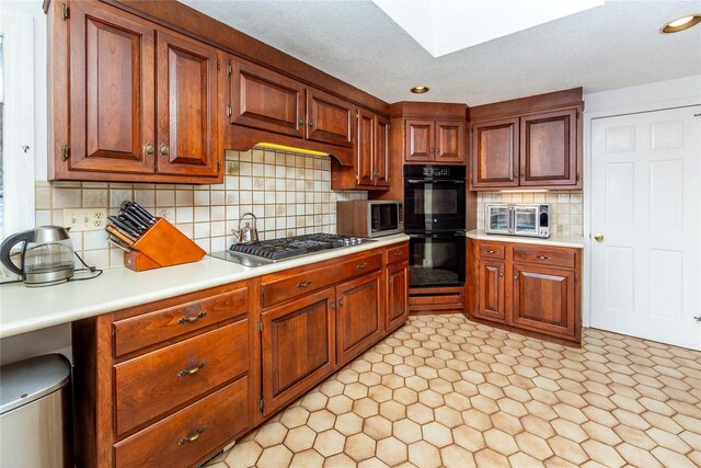 94 S Quaker Hill Rd, Pawling, NY 12564 - kitchen featuring stainless steel appliances, light countertops, tasteful backsplash, brown cabinetry, and recessed lighting