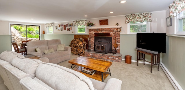 94 S Quaker Hill Rd, Pawling, NY 12564 - living room featuring a baseboard heating unit, a wood stove, healthy amount of natural light, recessed lighting, and ornamental molding