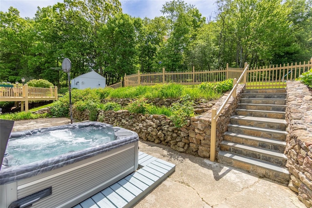 94 S Quaker Hill Rd, Pawling, NY 12564 - view of patio / terrace with a hot tub and view of wooded area