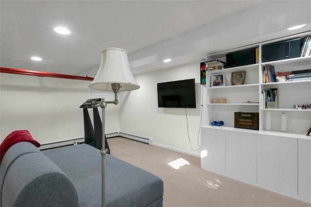 workout room with light carpet and a baseboard radiator