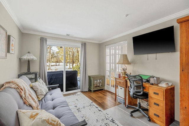 office featuring crown molding and light hardwood / wood-style flooring