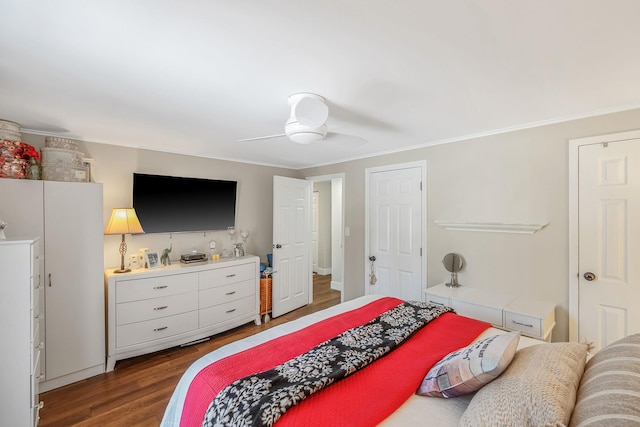 bedroom with ceiling fan, ornamental molding, and dark hardwood / wood-style floors