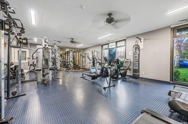 exercise room with ceiling fan