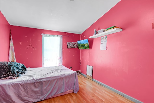 bedroom featuring hardwood / wood-style flooring