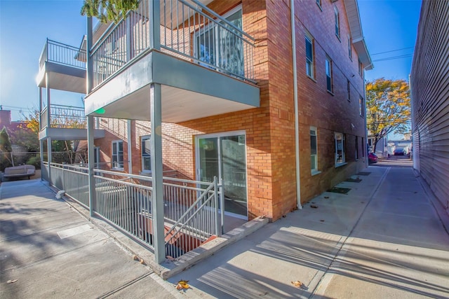 view of side of property with a balcony