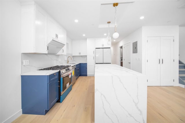 kitchen with gas stove, decorative light fixtures, white cabinetry, sink, and blue cabinets