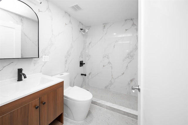 bathroom featuring toilet, tile walls, walk in shower, and vanity