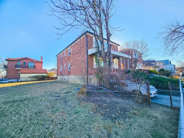 view of property exterior with a lawn