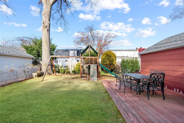 view of yard with a playground and a wooden deck