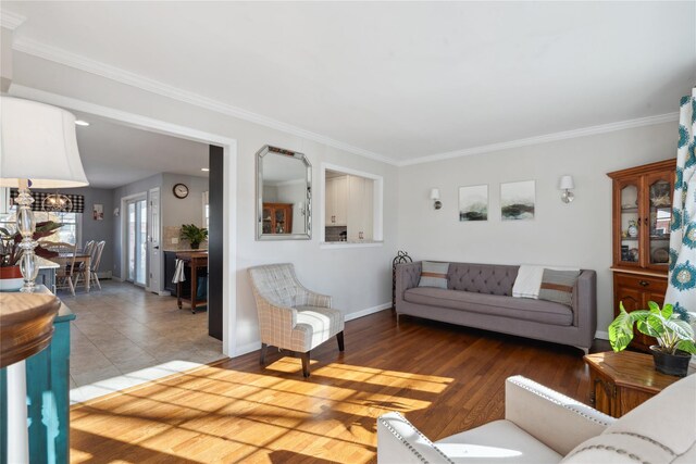 living room with hardwood / wood-style floors and crown molding