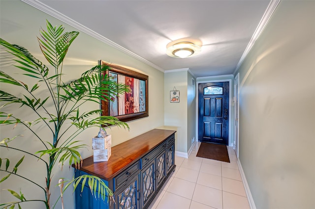 doorway to outside with ornamental molding and light tile patterned floors