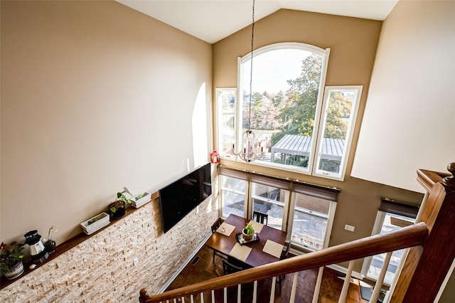 interior space with hardwood / wood-style floors and vaulted ceiling