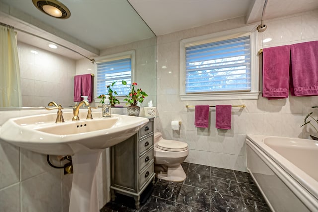 full bathroom featuring shower / tub combination, sink, tile walls, and toilet