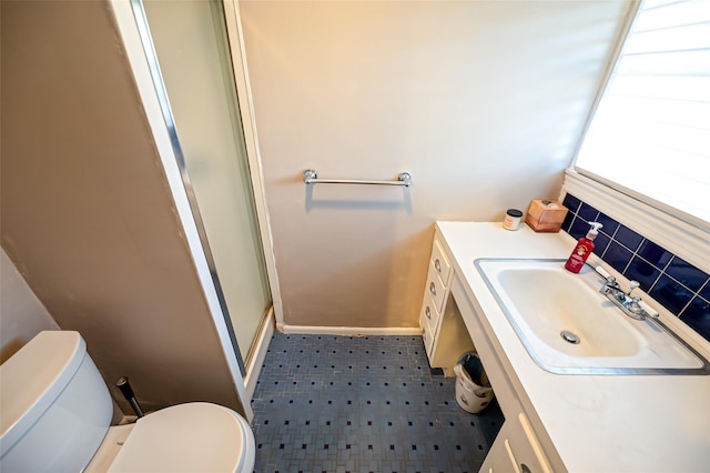 bathroom featuring walk in shower, vanity, and toilet