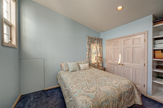 carpeted bedroom featuring a closet