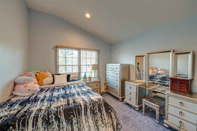 carpeted bedroom with lofted ceiling