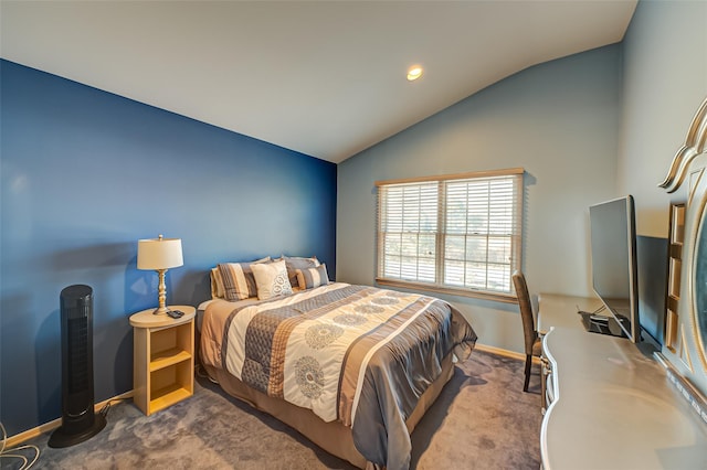 carpeted bedroom with lofted ceiling