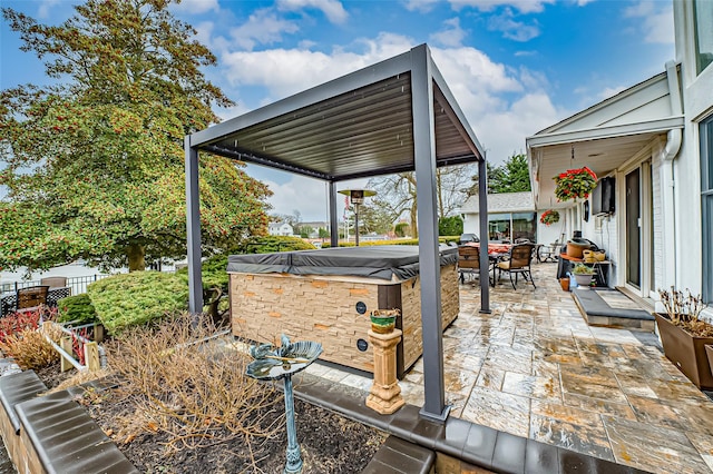 exterior space with a hot tub and a patio area