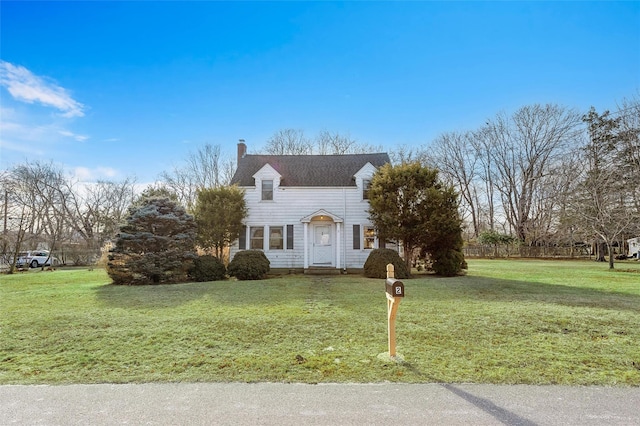 new england style home featuring a front lawn