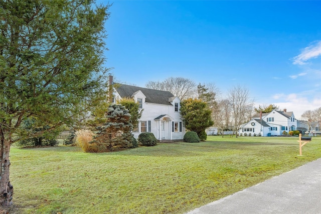 view of property exterior featuring a lawn